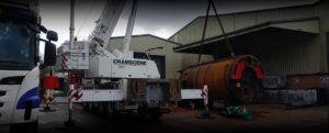 Industrial boiler being removed with large crane