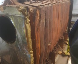 Old rusted water tank ready to be removed and scrapped